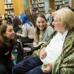 Three participants engage in dialogue at the 2019 Ikeda Forum