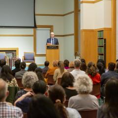 Executive Director Kevin Maher speaking at the 2022 Ikeda Forum