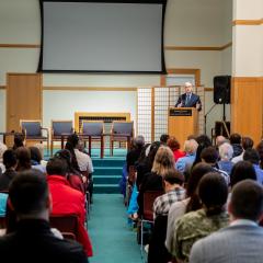 Executive Director Kevin Maher speaking at the 2023 Ikeda Forum