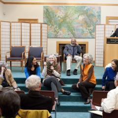 Panelists sit on stage in conversation during the 2010 Ikeda Forum