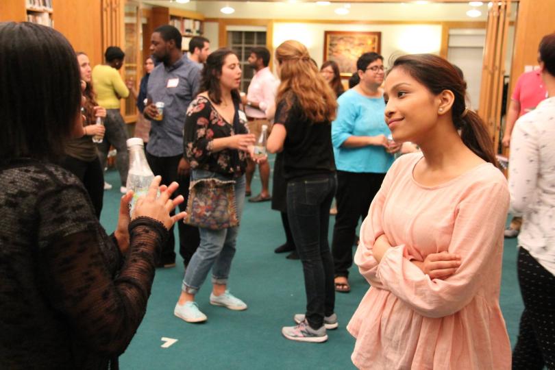 Woman listening at first Dialogue Nights