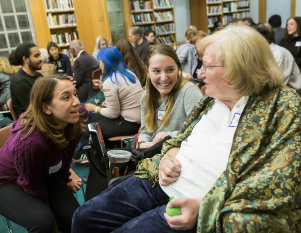 Three participants engage in dialogue at the 2019 Ikeda Forum