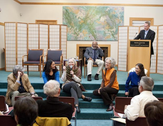 Panelists sit on stage in conversation during the 2010 Ikeda Forum