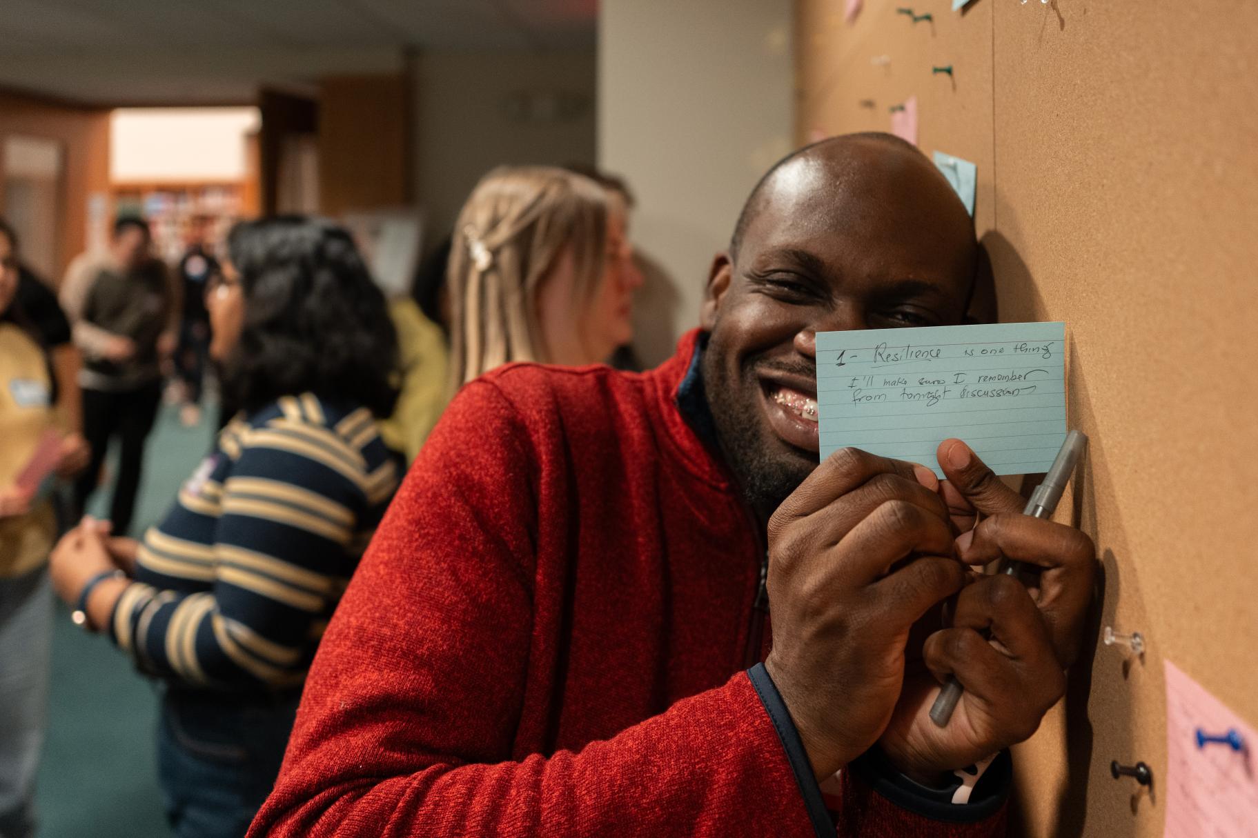 Participant at the Dialogue Wall at our March 2025 Dialogue Nights