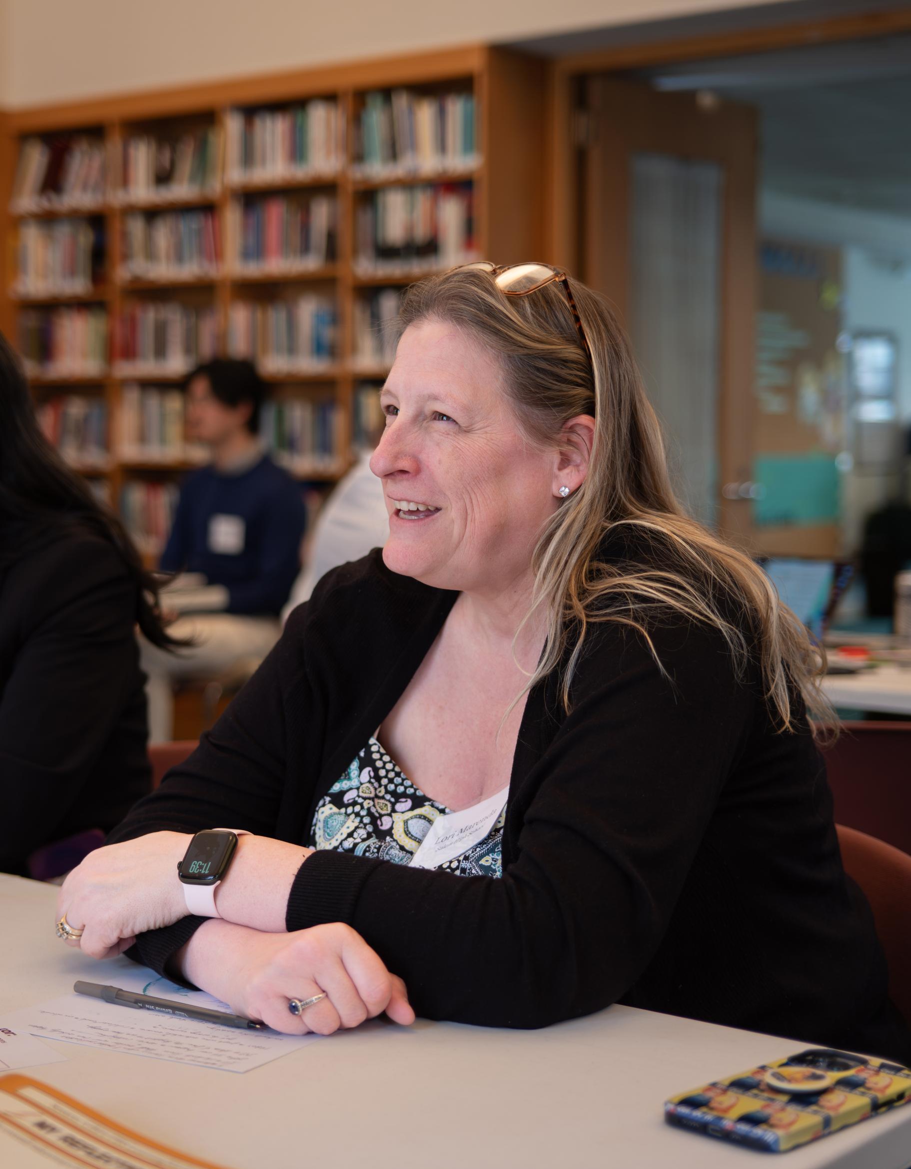 Candid photo of a participant smiling at the 2026 Educating for Peace conference