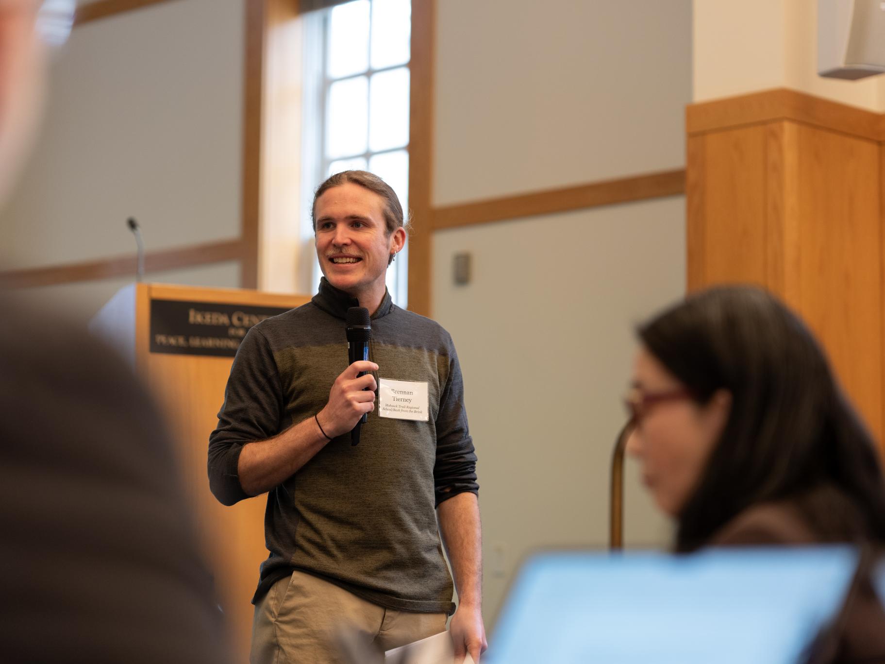 Brennan Tierney speaking at the 2026 Educating for Peace Conference