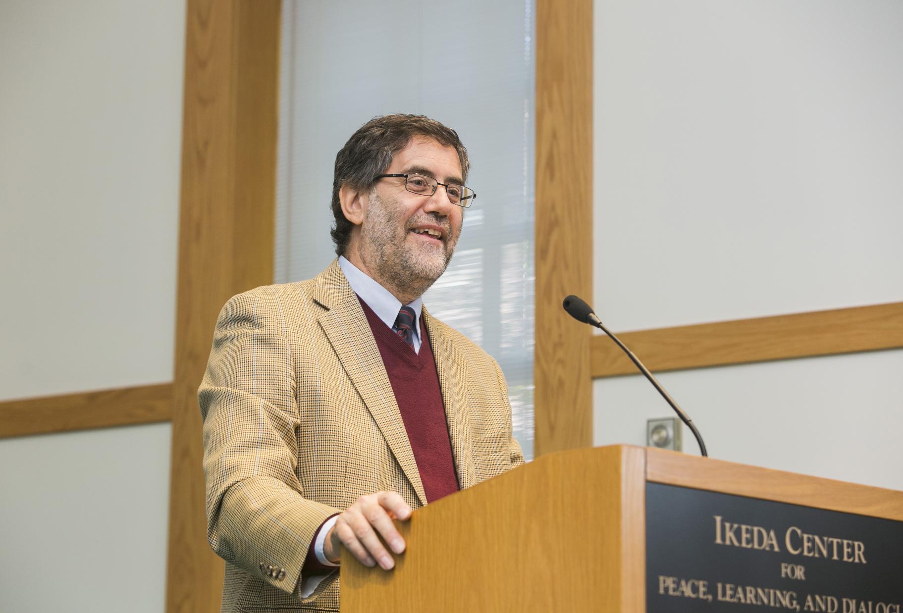 2014 Ikeda Forum Speaker Andrea Bartoli speaking at the podium