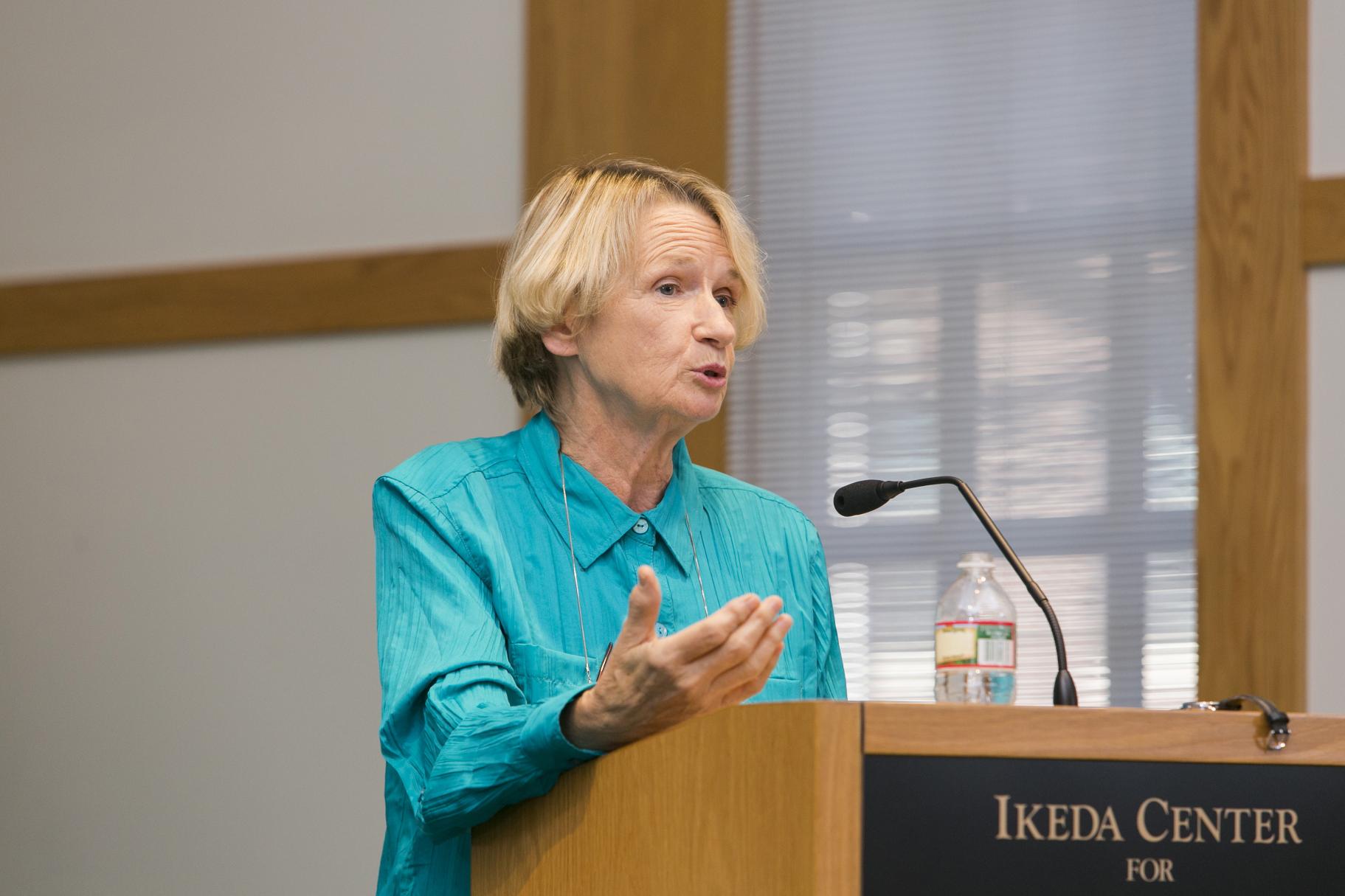 2014 Ikeda Forum speaker Mari Fitzduff speaking at the podium
