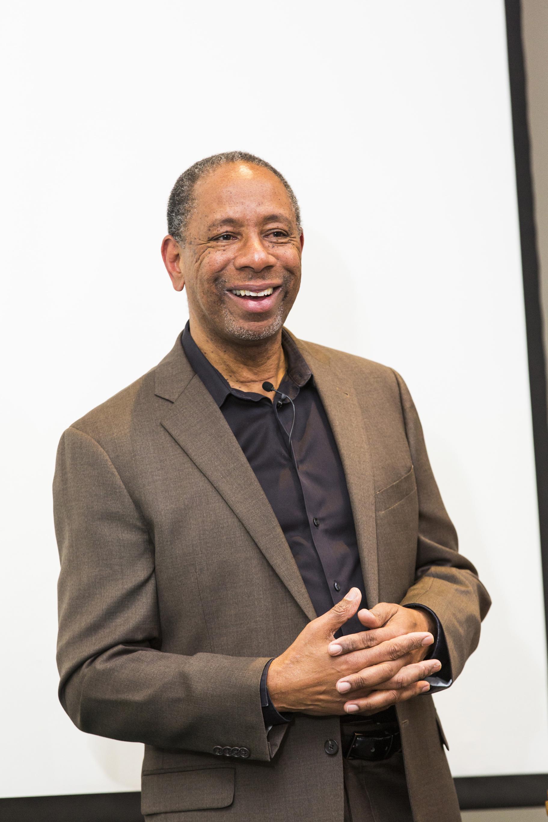 Dr. Ceasar McDowell speaking at the 2016 Ikeda Forum close up